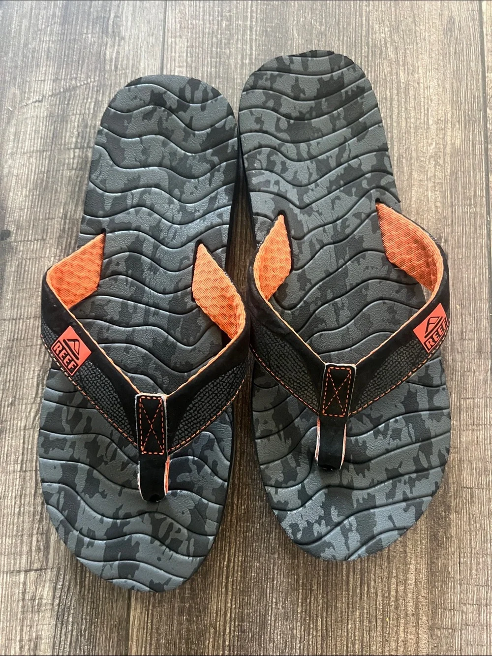 Reef Roundhouse Flip Flops in orange and black